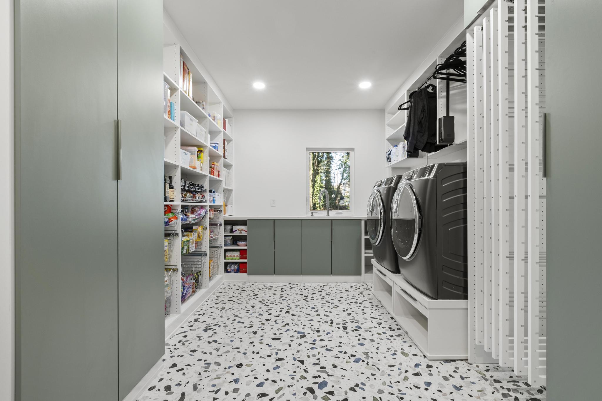 A laundry room with speckled flooring