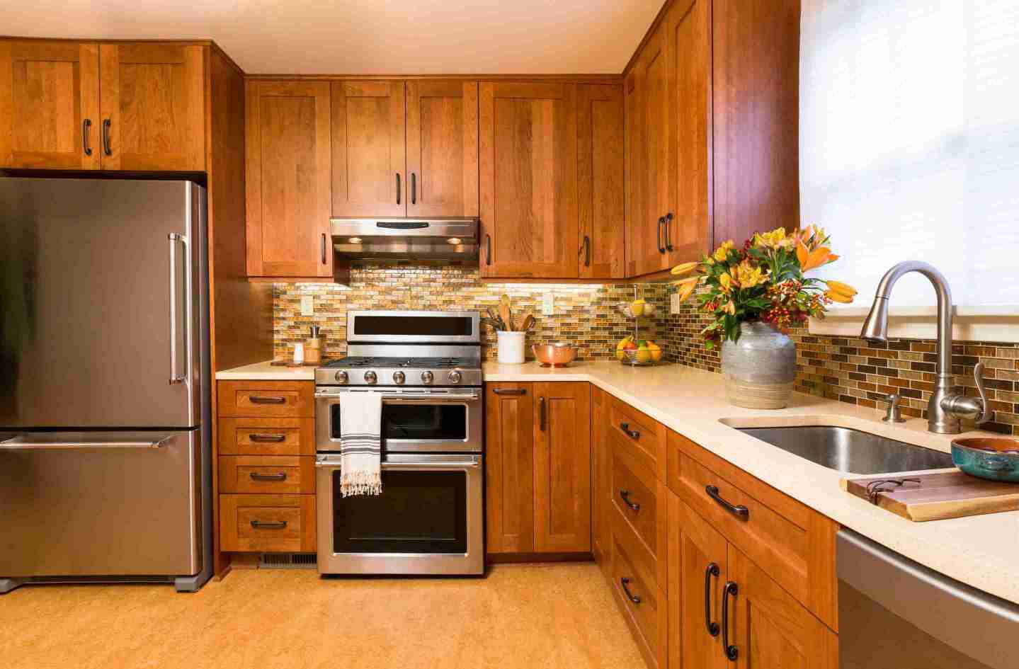 Cherry cabinets with tiles backsplash