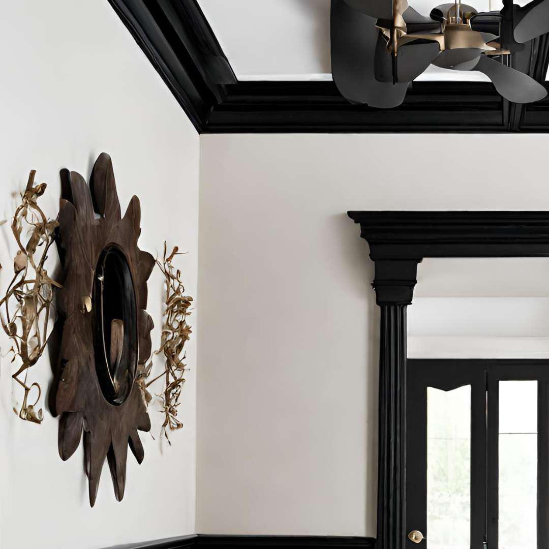 A wall with black crown molding
