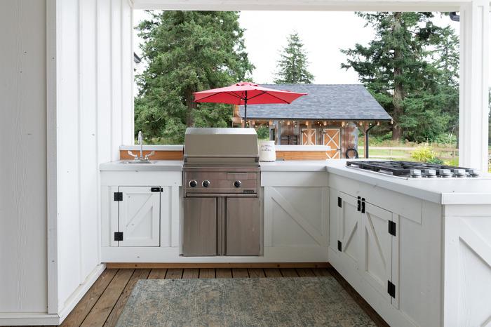 A farmhouse wood outdoor kitchen