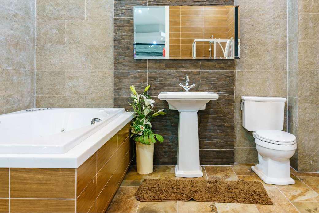 A bathroom with brown tiles