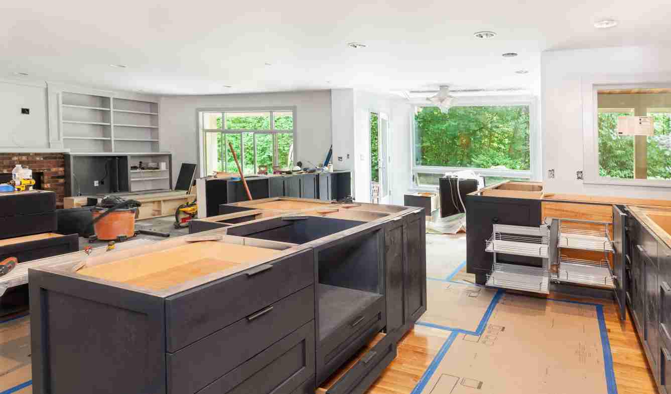 Kitchen cabinet installation with many items