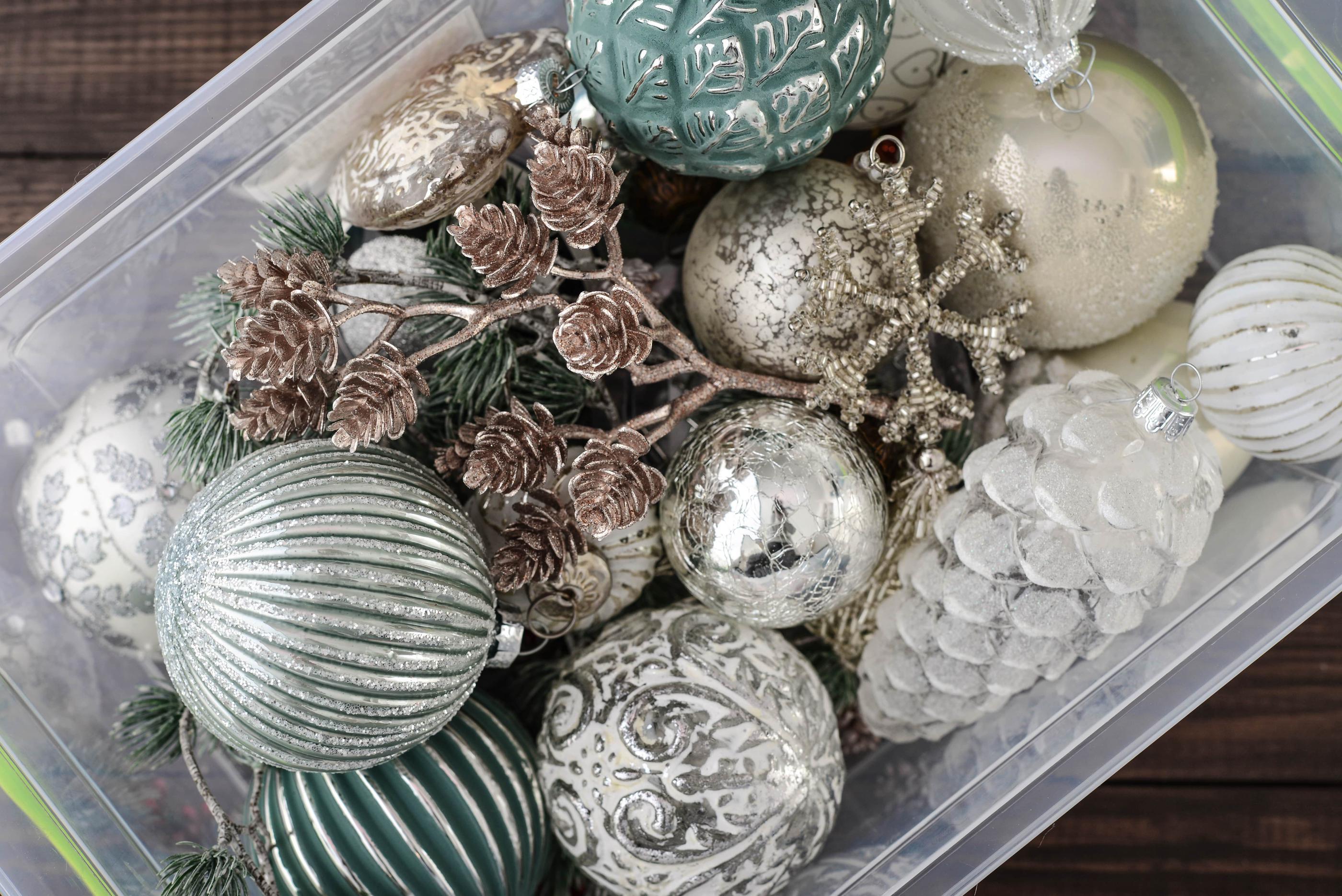 Whimsical holiday decor in a clear tote.
