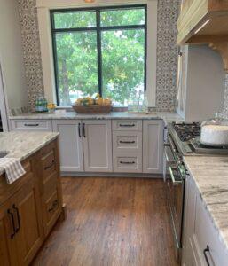 A kitchen with brown and white cabinets
