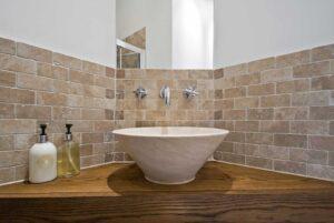 A bathroom with natural stone tiles