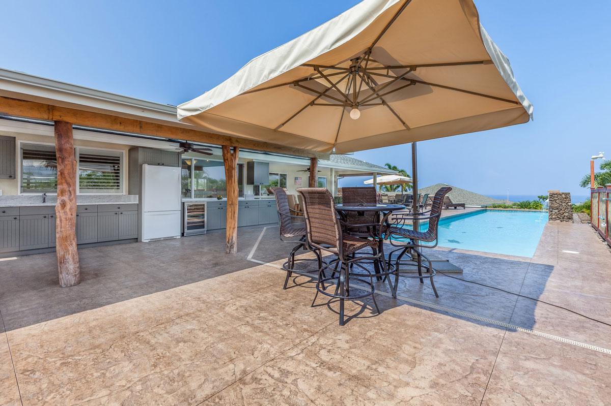 Outdoor kitchen next to pool