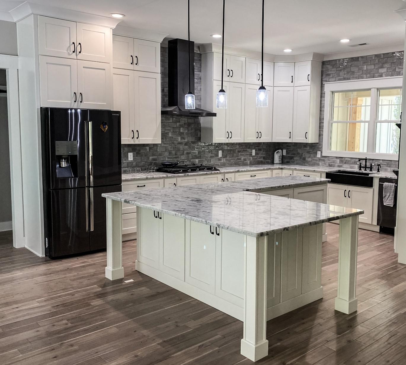 Large kitchen with white cabinets and island