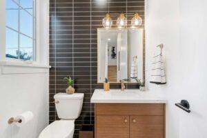 A bathroom with dark porcelain tiles