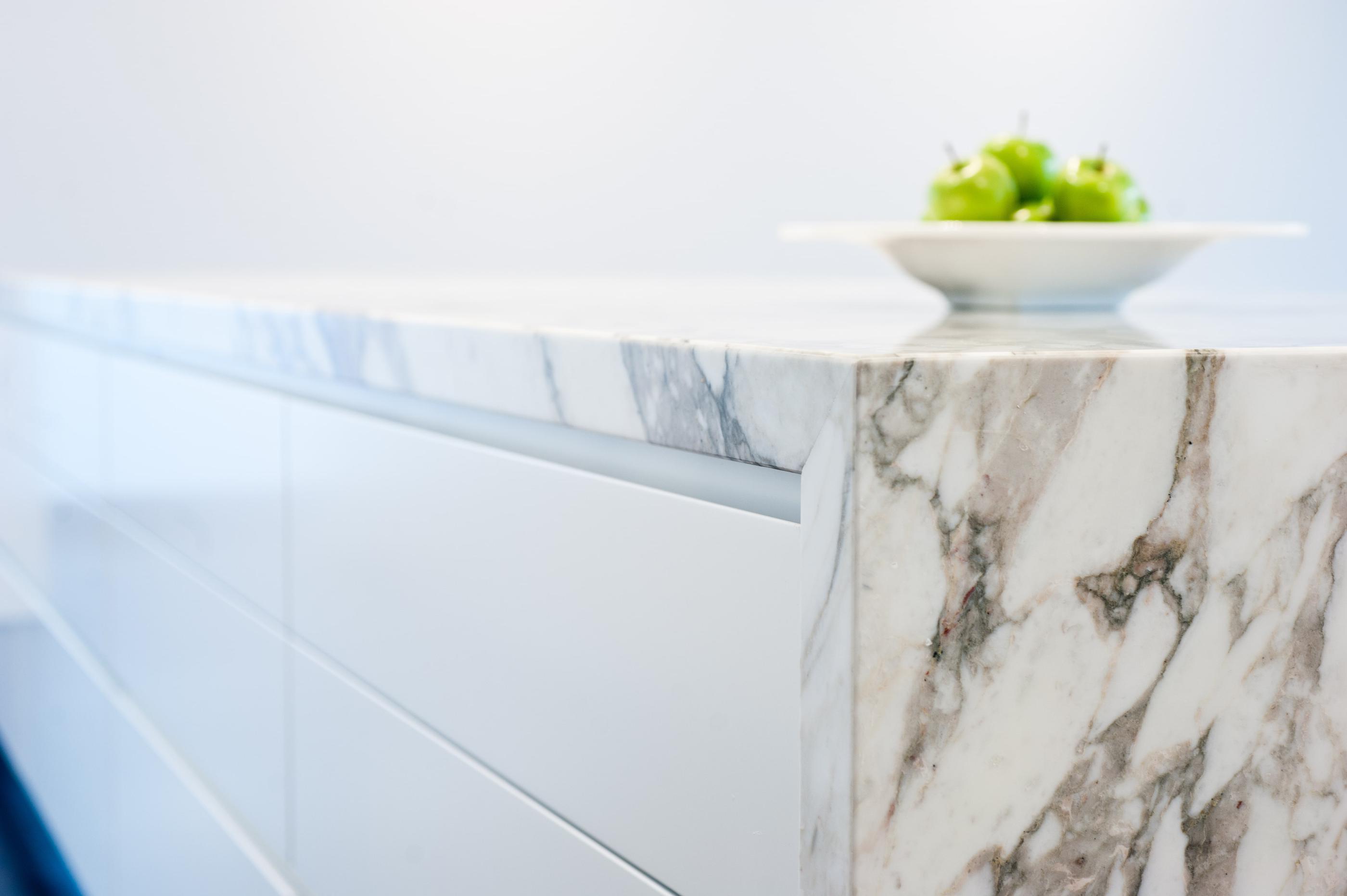 Waterfall edge countertop inspiration with a neutral color palette.