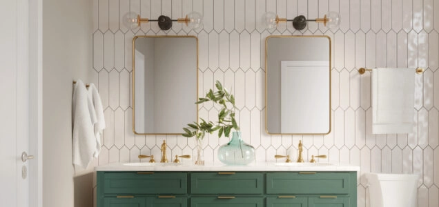 A renovated bathroom with a teal double sink vanity that is contrasted with floor-to-ceiling wall tiling in a white and geometric design