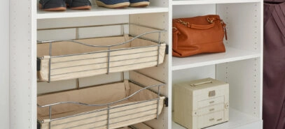 Close up of slidable storage bins in an open shelving section of a closet