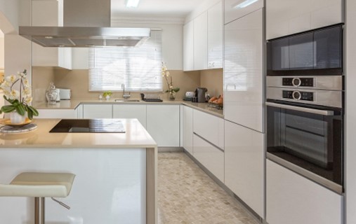 beige countertop with white cabinets