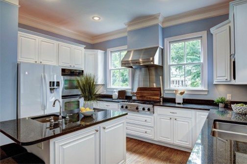 black countertop with white cabinets