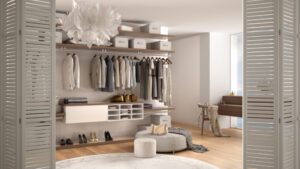 Walk in closet with various clothing and accessories 1